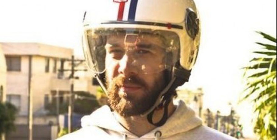 Person wearing a helmet and hoodie